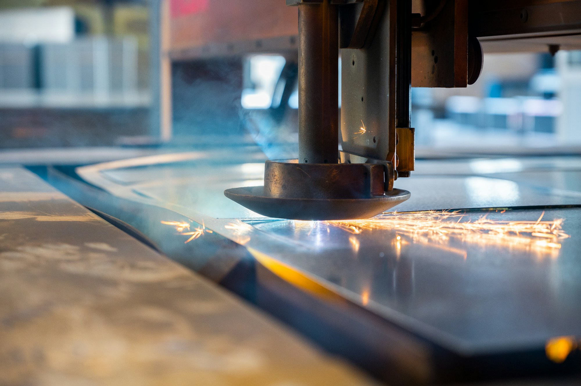 Laser cutting a sheet with sparks